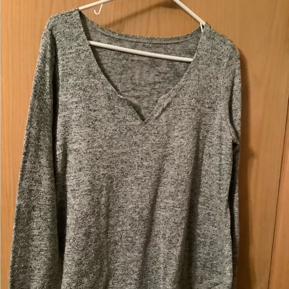 Womens long sleeved top by Maurice’s. Has sparkles. Size L